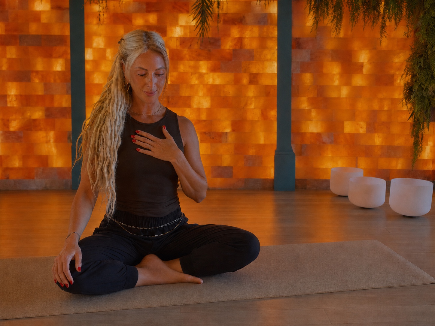 Lana Storm seated in a breathwork studio